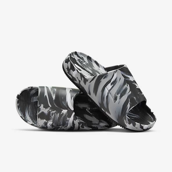 Nike black and white flip flops sales